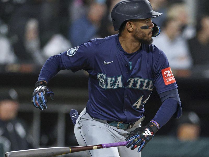 May 19, 2025; Chicago, Illinois, USA; Seattle Mariners center fielder Julio Rodríguez (44) watches his grand slam against the Chicago White Sox during the eight inning at Rate Field. Mandatory Credit: Kamil Krzaczynski-Imagn Images