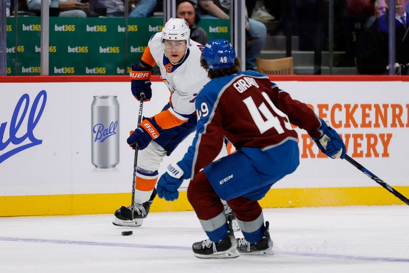 Oct 14, 2024; Denver, Colorado, USA; New York Islanders right wing Maxim Tsyplakov (7) controls the puck as Colorado Avalanche defenseman Samuel Girard (49) defends in the first period at Ball Arena. Mandatory Credit: Isaiah J. Downing-Imagn Images