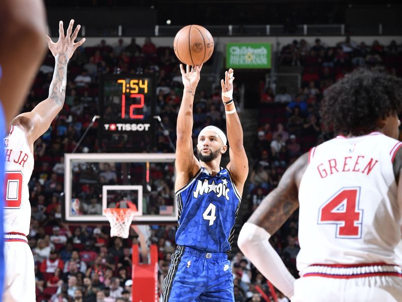 HOUSTON, TX - APRIL 9: Jalen Suggs #4 of the Orlando Magic shoots the ball during the game against the Houston Rockets on April 9, 2024 at the Toyota Center in Houston, Texas. NOTE TO USER: User expressly acknowledges and agrees that, by downloading and or using this photograph, User is consenting to the terms and conditions of the Getty Images License Agreement. Mandatory Copyright Notice: Copyright 2024 NBAE (Photo by Logan Riely/NBAE via Getty Images)