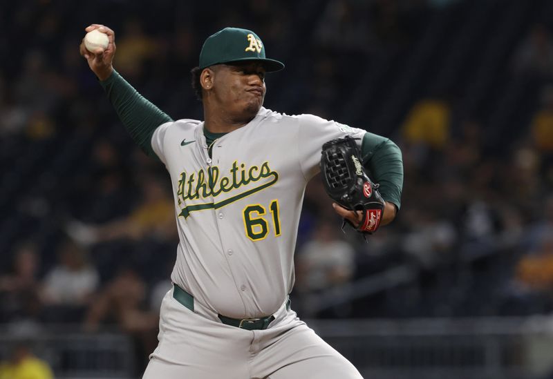 Sep 19, 2025; Pittsburgh, Pennsylvania, USA; Athletics relief pitcher Elvis Alvarado (61) pitches against the Pittsburgh Pirates during the sixth inning at PNC Park. Mandatory Credit: Charles LeClaire-Imagn Images