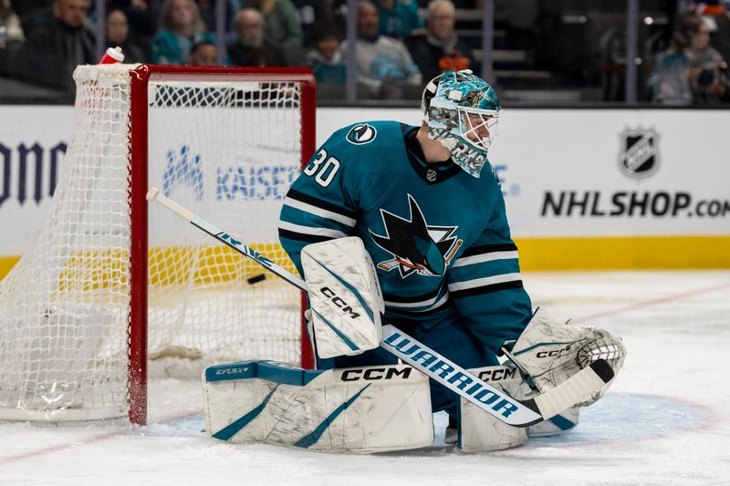 Dec 28, 2023; San Jose, California, USA; San Jose Sharks goalie Magnus Chrona (30) cannot stop the shot on goal against the Edmonton Oilers \d1p] at SAP Center at San Jose. Mandatory Credit: Neville E. Guard-USA TODAY Sports