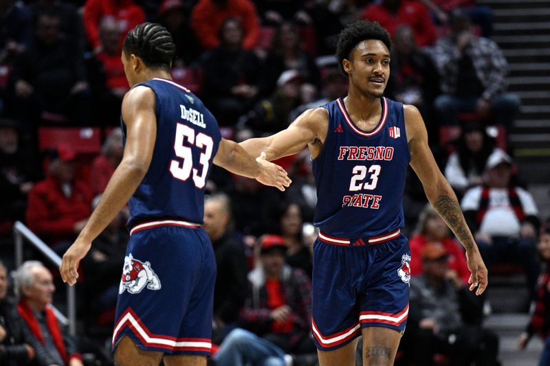 Jan 3, 2024; San Diego, California, USA; Fresno State Bulldogs guard Leo Colimerio (23) celebrates with guard Xavier DuSell (53) during the first half against the San Diego State Aztecs at Viejas Arena. Mandatory Credit: Orlando Ramirez-USA TODAY Sports 