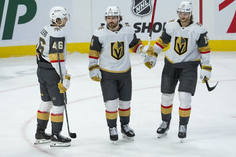 Jan 25, 2026; Ottawa, Ontario, CAN; Vegas Golden Knights defenseman Rasmus Anderssson (4 - center) celebrates with right wing Jonas Rondbjerg (46) and defenseman Noah Hanifin (15) his goal scored in the third period against the Ottawa Senators at the Canadian Tire Centre. Mandatory Credit: Marc DesRosiers-IMAGN Images