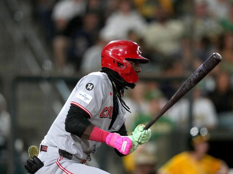 Sep 12, 2025; West Sacramento, California, USA; Cincinnati Reds shortstop Elly De La Cruz (44) hits a single against the Athletics in the third inning at Sutter Health Park. Mandatory Credit: Cary Edmondson-Imagn Images