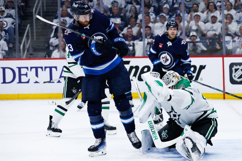 May 15, 2025; Winnipeg, Manitoba, CAN; Dallas Stars goalie Jake Oettinger (29) makes a save as Winnipeg Jets forward Gabriel Vilardi (13) looks for a rebound during  the second period in game five of the second round of the 2025 Stanley Cup Playoffs at Canada Life Centre. Mandatory Credit: Terrence Lee-Imagn Images
