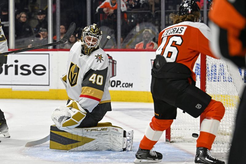 Dec 11, 2025; Philadelphia, Pennsylvania, USA; Vegas Golden Knights goaltender Akira Schmid (40) reacts as Philadelphia Flyers center Trevor Zegras (46) scores a goal during the first period at Xfinity Mobile Arena. Mandatory Credit: Eric Hartline-Imagn Images