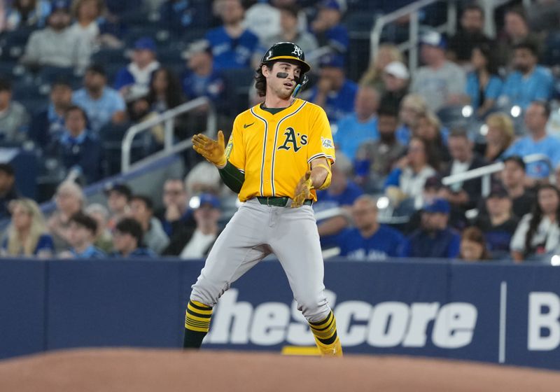 May 31, 2025; Toronto, Ontario, CAN; Athletics shortstop Jacob Wilson (5) celebrates hitting a single against the Toronto Blue Jays during the first inning at Rogers Centre. Mandatory Credit: Nick Turchiaro-Imagn Images
