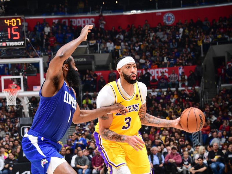 LOS ANGELES, CA - JANUARY 23:  Anthony Davis #3 of the Los Angeles Lakers handles the ball during the game on January 23, 2024 at Crypto.Com Arena in Los Angeles, California. NOTE TO USER: User expressly acknowledges and agrees that, by downloading and/or using this Photograph, user is consenting to the terms and conditions of the Getty Images License Agreement. Mandatory Copyright Notice: Copyright 2024 NBAE (Photo by Adam Pantozzi/NBAE via Getty Images)