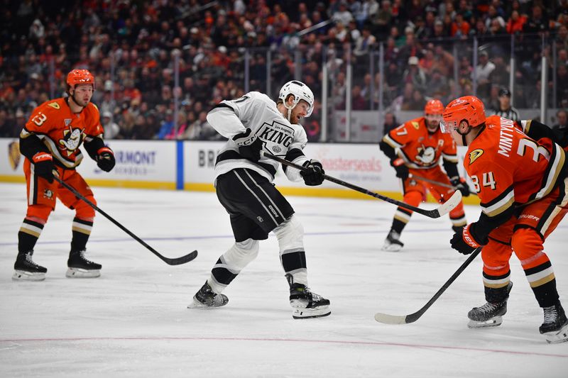 Nov 29, 2024; Anaheim, California, USA; Los Angeles Kings left wing Warren Foegele (37) shoots on goal against the Anaheim Ducks during the third period at Honda Center. Mandatory Credit: Gary A. Vasquez-Imagn Images