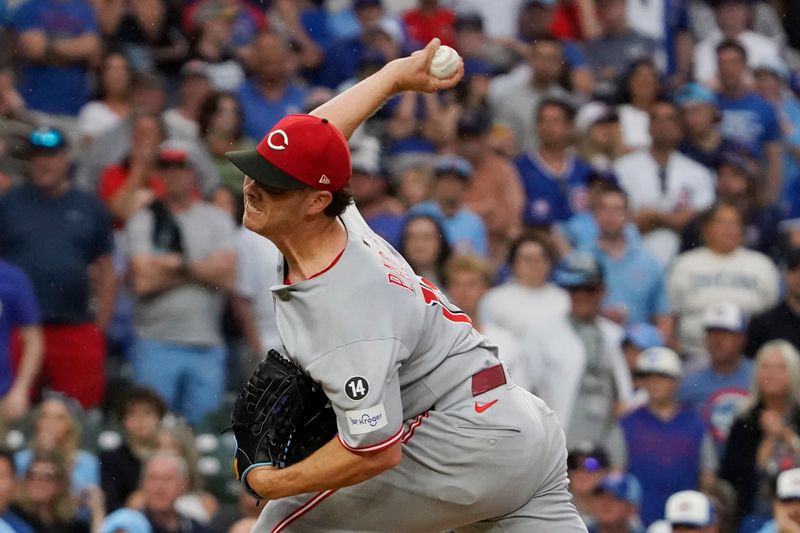 May 30, 2025; Chicago, Illinois, USA; Cincinnati Reds pitcher Emilio Pagan (15) throws the ball against the Chicago Cubs during the ninth inning  at Wrigley Field. Mandatory Credit: David Banks-Imagn Images