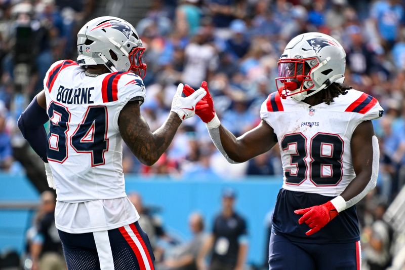 New England Patriots running back Rhamondre Stevenson (38) celebrates a touchdown with wide receiver Kendrick Bourne (84) against the Tennessee Titans during the second half of an NFL football game in Nashville, Tenn., Sunday, Nov. 3, 2024. (AP Photo/John Amis)