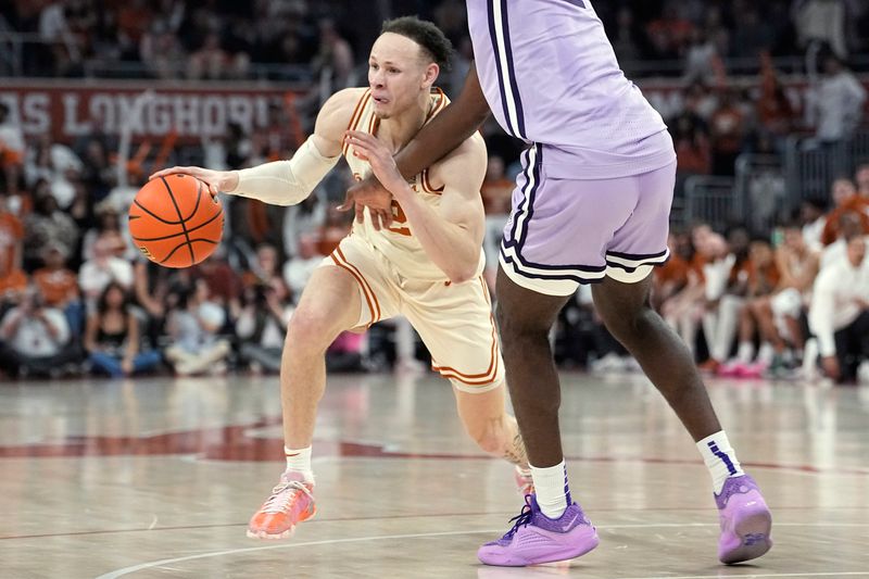 Feb 19, 2024; Austin, Texas, USA; Texas Longhorns guard Chendall Weaver (2) dr moves to the basket during the first half against the Kansas State Wildcats at Moody Center. Mandatory Credit: Scott Wachter-USA TODAY Sports