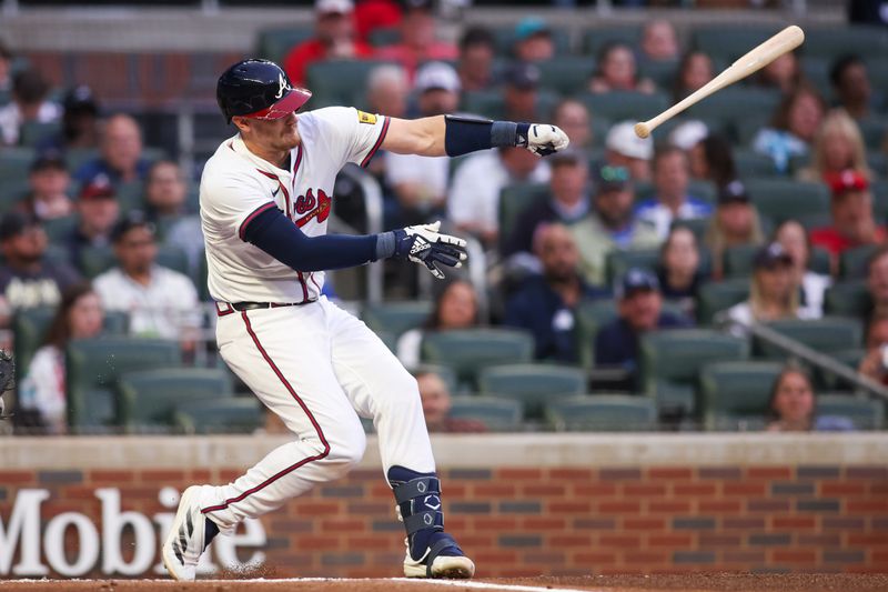 Apr 10, 2025; Atlanta, Georgia, USA; Atlanta Braves catcher Sean Murphy (12) throws the bat on a swing against the Philadelphia Phillies in the first inning at Truist Park. Mandatory Credit: Brett Davis-Imagn Images
