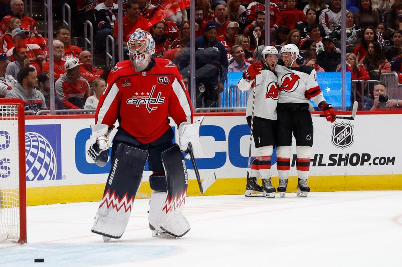 Oct 12, 2024; Washington, District of Columbia, USA; New Jersey Devils center Paul Cotter (47) celebrates after scoring a goal on Washington Capitals goaltender Charlie Lindgren (79) in the second period at Capital One Arena. Mandatory Credit: Geoff Burke-Imagn Images