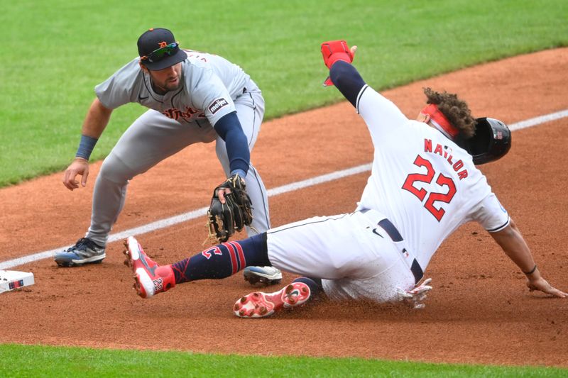 May 6, 2024; Cleveland, Ohio, USA; Cleveland Guardians first baseman Josh Naylor (22) is tagged out by Detroit Tigers third baseman Matt Vierling (8) in the first inning at Progressive Field. Mandatory Credit: David Richard-USA TODAY Sports