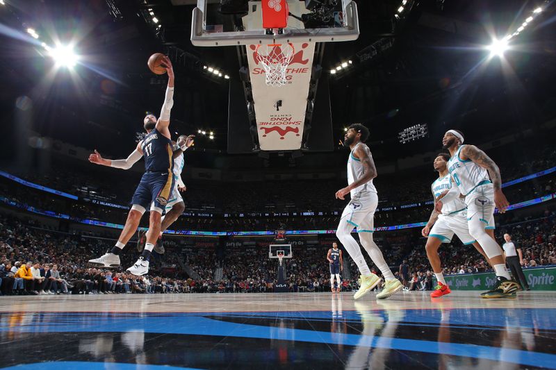 NEW ORLEANS, LA - JANUARY 17: Jonas Valanciunas #17 of the New Orleans Pelicans grabs a rebound during the game against the Charlotte Hornets on January 17, 2024 at the Smoothie King Center in New Orleans, Louisiana. NOTE TO USER: User expressly acknowledges and agrees that, by downloading and or using this Photograph, user is consenting to the terms and conditions of the Getty Images License Agreement. Mandatory Copyright Notice: Copyright 2024 NBAE (Photo by Layne Murdoch Jr./NBAE via Getty Images)