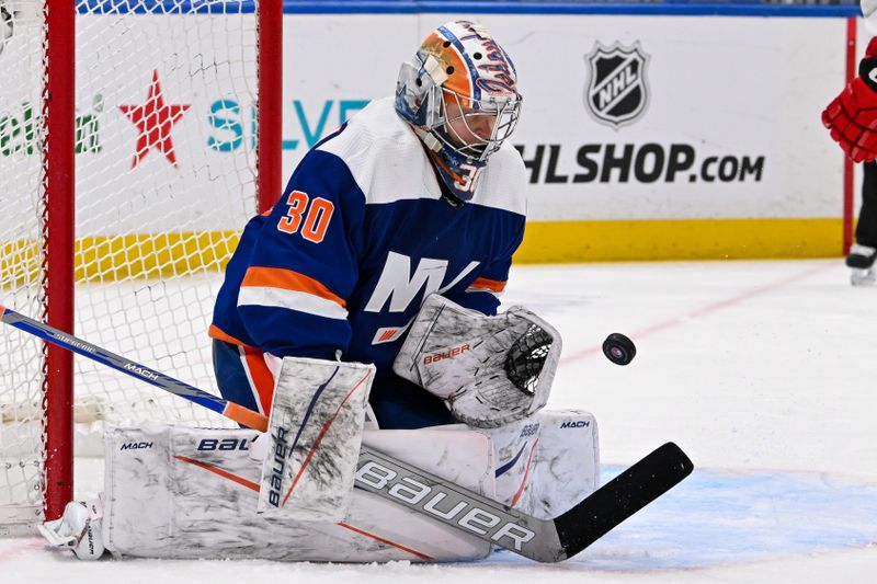 Mar 24, 2024; Elmont, New York, USA; New York Islanders goaltender Ilya Sorokin (30) makes a save against the New Jersey Devils during the third period at UBS Arena. Mandatory Credit: Dennis Schneidler-USA TODAY Sports