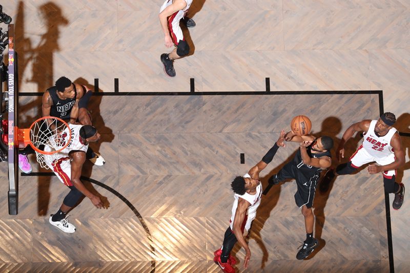 BROOKLYN, NY - JANUARY 15: Mikal Bridges #1 of the Brooklyn Nets shoots the ball during the game against the Miami Heat on January 15, 2024 at Barclays Center in Brooklyn, New York. NOTE TO USER: User expressly acknowledges and agrees that, by downloading and or using this Photograph, user is consenting to the terms and conditions of the Getty Images License Agreement. Mandatory Copyright Notice: Copyright 2024 NBAE (Photo by Nathaniel S. Butler/NBAE via Getty Images)