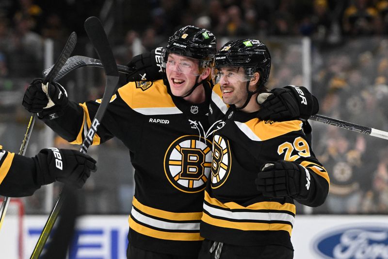 Jan 14, 2025; Boston, Massachusetts, USA; Boston Bruins defenseman Parker Wotherspoon (29) celebrates with defenseman Mason Lohrei (6) after scoring a goal against the Tampa Bay Lightning during the first period at the TD Garden. Mandatory Credit: Brian Fluharty-Imagn Images