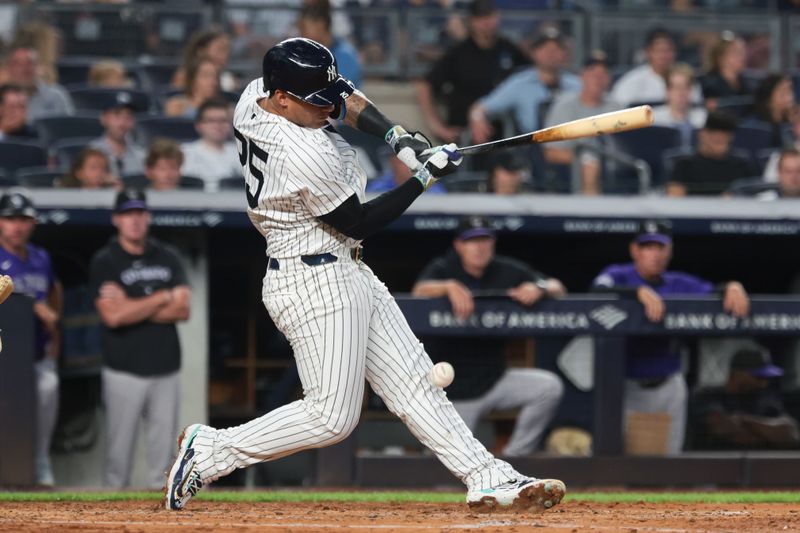 Aug 23, 2024; Bronx, New York, USA; New York Yankees second baseman Gleyber Torres (25) fouls a ball off of his leg during the third inning against the Colorado Rockies at Yankee Stadium. Mandatory Credit: Vincent Carchietta-USA TODAY Sports