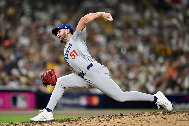 Oct 9, 2024; San Diego, California, USA; Los Angeles Dodgers pitcher Alex Vesia (51) throws in the fourth inning against the San Diego Padres during game four of the NLDS for the 2024 MLB Playoffs at Petco Park.  Mandatory Credit: Denis Poroy-Imagn Images