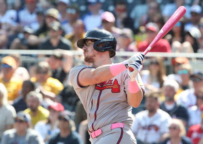 May 11, 2025; Pittsburgh, Pennsylvania, USA;  Atlanta Braves pinch hitter Sean Murphy (12) hits a three run double against the Pittsburgh Pirates during the eighth inning at PNC Park. Mandatory Credit: Charles LeClaire-Imagn Images