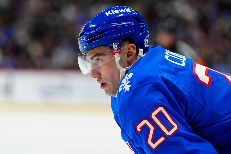 Jan 12, 2026; Denver, Colorado, USA; Colorado Avalanche center Ross Colton (20) during the second period against the Toronto Maple Leafs at Ball Arena. Mandatory Credit: Ron Chenoy-Imagn Images