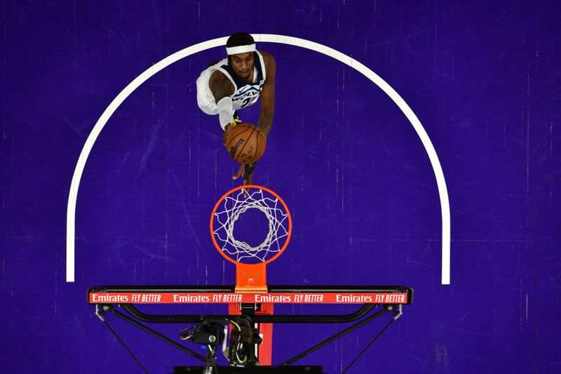 PHOENIX, AZ - APRIL  28: Jaden McDaniels #3 of the Minnesota Timberwolves shoots the ball during the game against the Phoenix Suns during Round 1 Game 4 of the 2024 NBA Playoffs on April 28, 2024 at Footprint Center in Phoenix, Arizona. NOTE TO USER: User expressly acknowledges and agrees that, by downloading and or using this photograph, user is consenting to the terms and conditions of the Getty Images License Agreement. Mandatory Copyright Notice: Copyright 2024 NBAE (Photo by Kate Frese/NBAE via Getty Images)