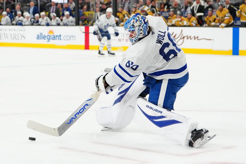 Jan 15, 2026; Las Vegas, Nevada, USA; Toronto Maple Leafs goaltender Joseph Woll (60) clears the puck during a power play against the Vegas Golden Knights during the second period at T-Mobile Arena. Mandatory Credit: Stephen R. Sylvanie-Imagn Images