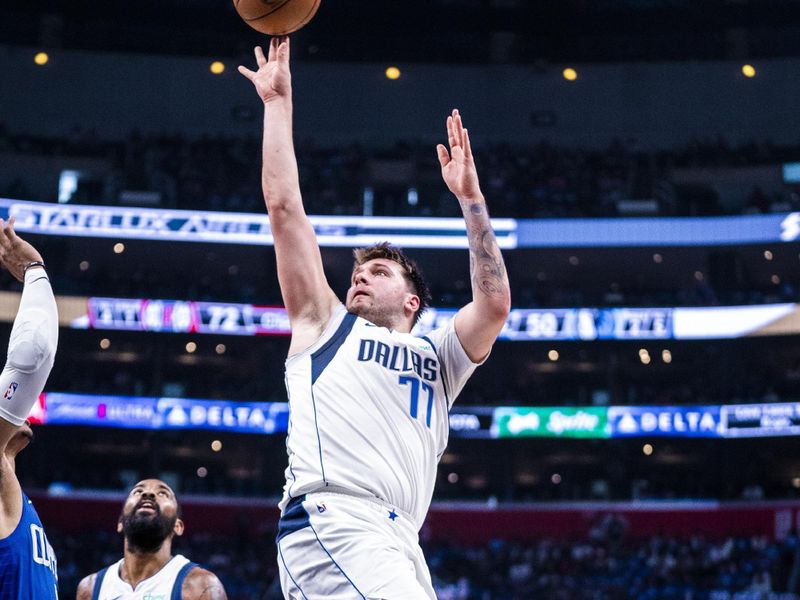 LOS ANGELES, CA - APRIL 21: Luka Doncic #77 of the Dallas Mavericks shoots the ball during the game against the LA Clippers during the 2024 NBA Playoffs on April 21, 2024 at Crypto.Com Arena in Los Angeles, California. NOTE TO USER: User expressly acknowledges and agrees that, by downloading and/or using this Photograph, user is consenting to the terms and conditions of the Getty Images License Agreement. Mandatory Copyright Notice: Copyright 2024 NBAE (Photo by Tyler Ross/NBAE via Getty Images)