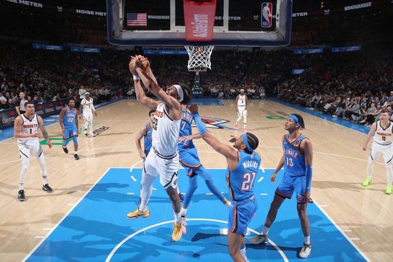 OKLAHOMA CITY, OK - JANUARY 31: Zeke Nnaji #22 of the Denver Nuggets rebounds the ball during the game against the Oklahoma City Thunder on January 31, 2024 at Paycom Arena in Oklahoma City, Oklahoma. NOTE TO USER: User expressly acknowledges and agrees that, by downloading and or using this photograph, User is consenting to the terms and conditions of the Getty Images License Agreement. Mandatory Copyright Notice: Copyright 2024 NBAE (Photo by Zach Beeker/NBAE via Getty Images)