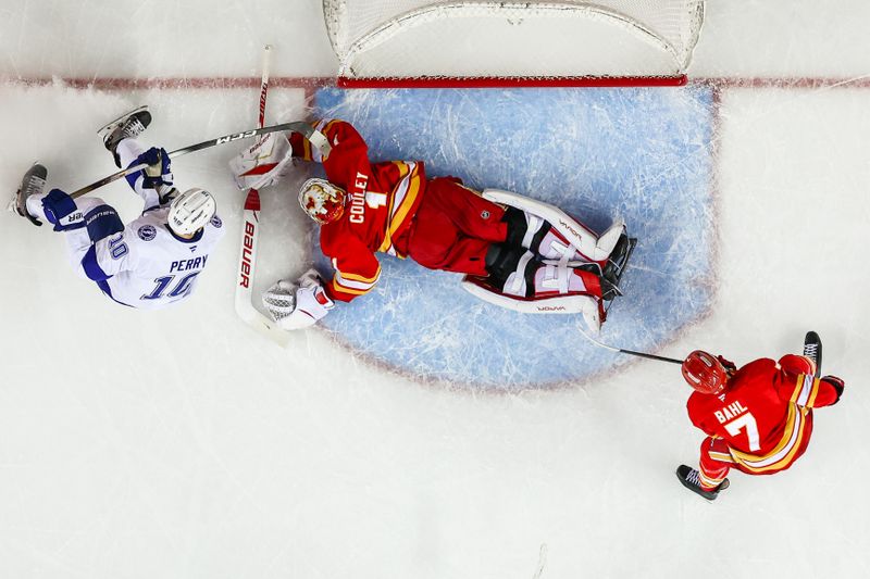 Mar 22, 2026; Calgary, Alberta, CAN; Calgary Flames goaltender Devin Cooley (1) makes a save against the Tampa Bay Lightning during the second period at Scotiabank Saddledome. Mandatory Credit: Sergei Belski-Imagn Images