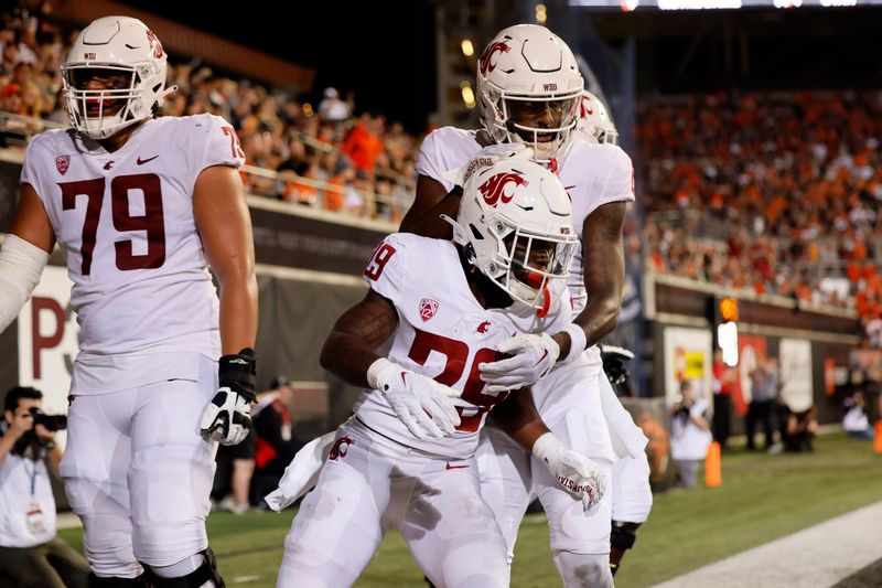 Oct 15, 2022; Corvallis, Oregon, USA; Washington State Cougars running back Jaylen Jenkins (29) celebrates with teammates after scoring a touchdown during the second half against the Oregon State Beavers at Reser Stadium. Mandatory Credit: Soobum Im-USA TODAY Sports