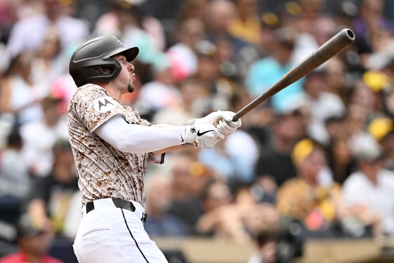 Sep 14, 2025; San Diego, California, USA; San Diego Padres center fielder Jackson Merrill (3) hits a three-run home run during the second inning against the Colorado Rockies at Petco Park. Mandatory Credit: Denis Poroy-Imagn Images