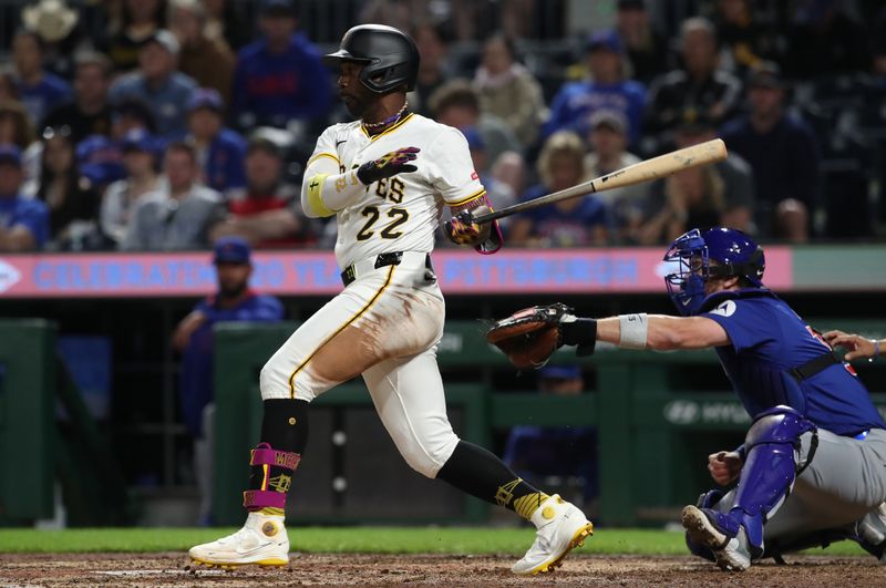 Apr 30, 2025; Pittsburgh, Pennsylvania, USA;  Pittsburgh Pirates designated hitter Andrew McCutchen (22) hits a two-run double against the Chicago Cubs during the seventh inning at PNC Park. Mandatory Credit: Charles LeClaire-Imagn Images
