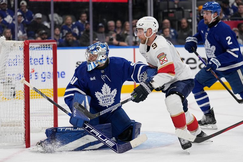 May 5, 2025; Toronto, Ontario, CAN; Toronto Maple Leafs goaltender Anthony Stolarz (41) and Florida Panthers forward Sam Bennett (9) battle for position in front of the goal during the second period of the second round of the 2025 Stanley Cup Playoffs at Scotiabank Arena. Mandatory Credit: John E. Sokolowski-Imagn Images