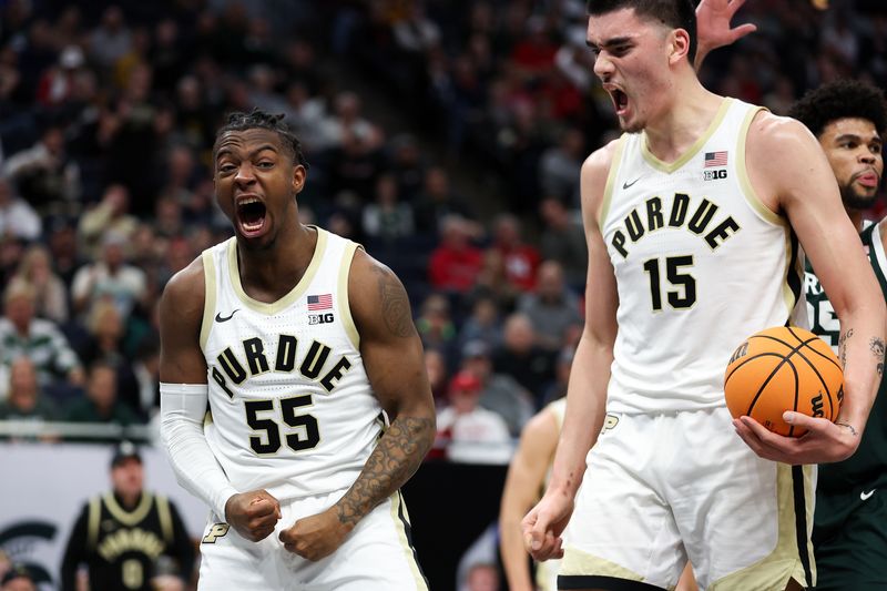 Mar 15, 2024; Minneapolis, MN, USA; Purdue Boilermakers guard Lance Jones (55) celebrates his basket against the Michigan State Spartans during the first half at Target Center. Mandatory Credit: Matt Krohn-USA TODAY Sports