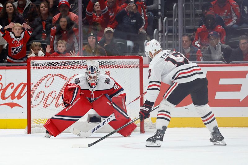 Jan 3, 2026; Washington, District of Columbia, USA; Chicago Blackhawks left wing Nick Foligno (17) scores the game winning goal on Washington Capitals goaltender Logan Thompson (48) in a shootout at Capital One Arena. Mandatory Credit: Geoff Burke-Imagn Images