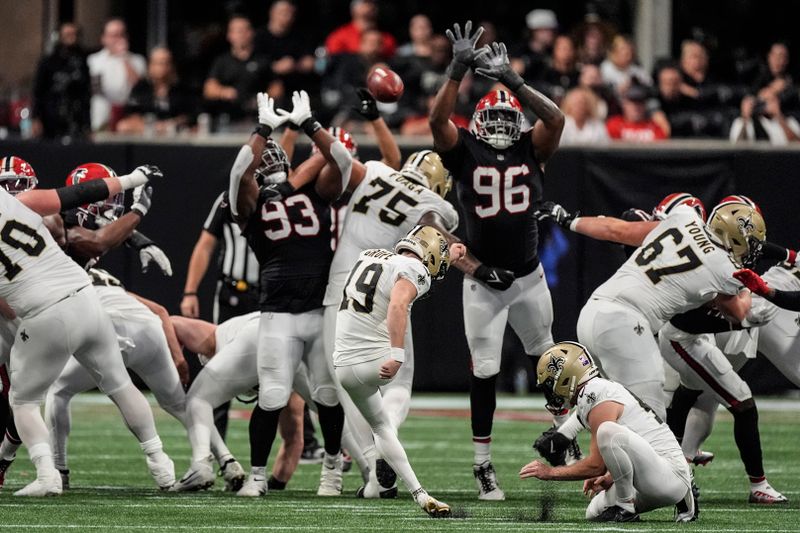 New Orleans Saints place kicker Blake Grupe (19) makes the field goal against the Atlanta Falcons during the second half of an NFL football game, Sunday, Sept. 29, 2024, in Atlanta. (AP Photo/John Bazemore)