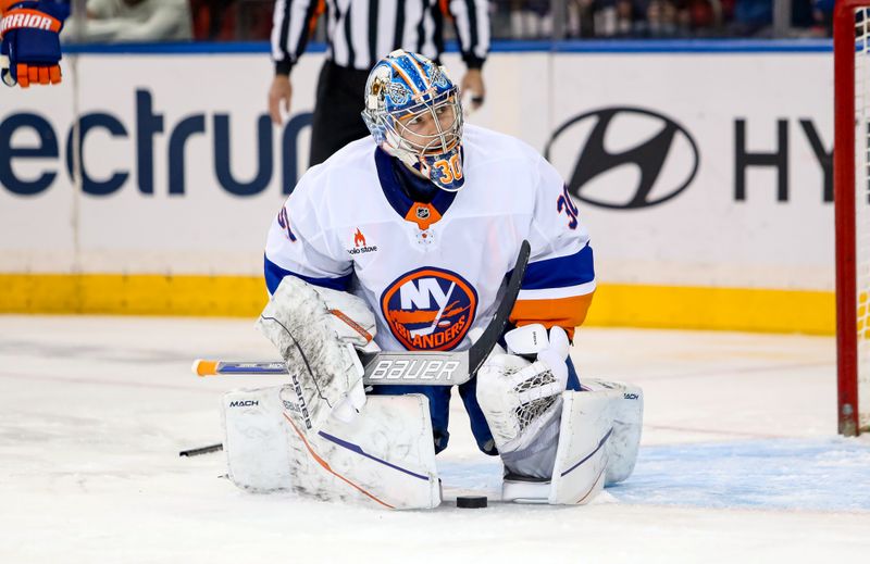 Nov 3, 2024; New York, New York, USA; New York Islanders goalie Ilya Sorokin (30) makes a save against the New York Rangers during the third period at Madison Square Garden. Mandatory Credit: Danny Wild-Imagn Images