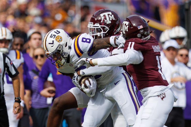 Nov 25, 2023; Baton Rouge, Louisiana, USA;  LSU Tigers wide receiver Malik Nabers (8) rushes against Texas A&M Aggies defensive back Deuce Harmon (11) during the first half at Tiger Stadium. Mandatory Credit: Stephen Lew-USA TODAY Sports