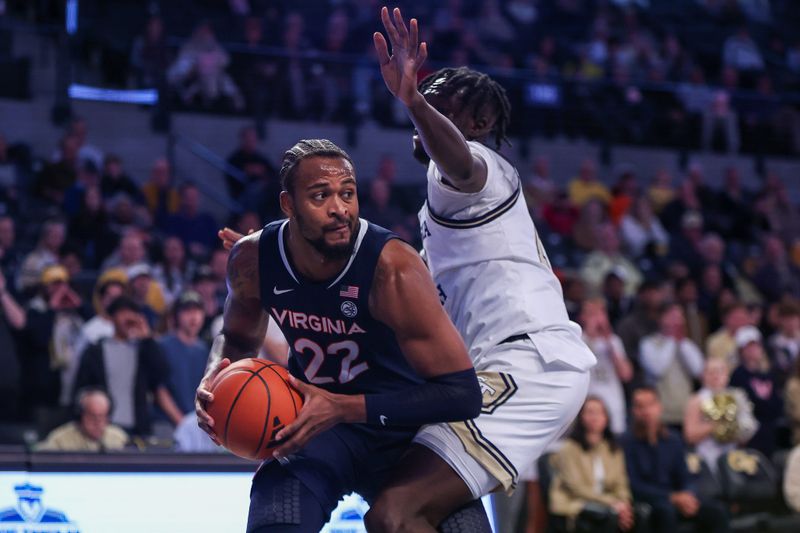 Jan 20, 2024; Atlanta, Georgia, USA; Virginia Cavaliers forward Jordan Minor (22) is defended by Georgia Tech Yellow Jackets forward Ebenezer Dowuona (10) in the first half at McCamish Pavilion. Mandatory Credit: Brett Davis-USA TODAY Sports