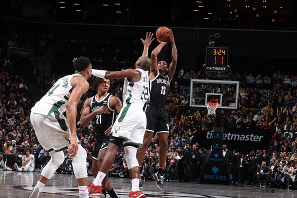 BROOKLYN, NY - DECEMBER 27: Armoni Brooks #13 of the Brooklyn Nets shoots a three point basket against the Milwaukee Bucks on December 27, 2023 at Barclays Center in Brooklyn, New York. NOTE TO USER: User expressly acknowledges and agrees that, by downloading and or using this Photograph, user is consenting to the terms and conditions of the Getty Images License Agreement. Mandatory Copyright Notice: Copyright 2023 NBAE (Photo by Nathaniel S. Butler/NBAE via Getty Images)