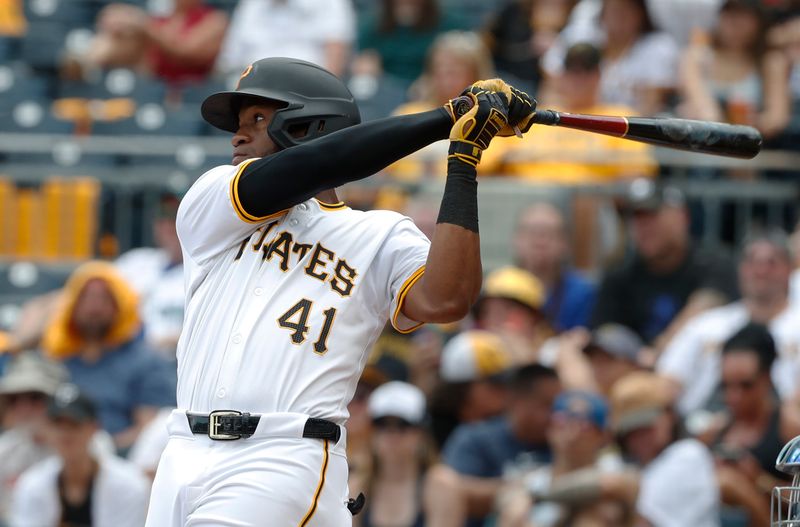 Aug 17, 2024; Pittsburgh, Pennsylvania, USA;  Pittsburgh Pirates left fielder Bryan De La Cruz (41) hits an RBI single against the Seattle Mariners during the sixth inning at PNC Park. Mandatory Credit: Charles LeClaire-USA TODAY Sports