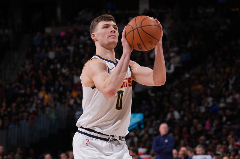 DENVER, CO - FEBRUARY 4:  Christian Braun #0 of the Denver Nuggets shoots a free throw during the game against the Portland Trail Blazers on February 4, 2024 at the Ball Arena in Denver, Colorado. NOTE TO USER: User expressly acknowledges and agrees that, by downloading and/or using this Photograph, user is consenting to the terms and conditions of the Getty Images License Agreement. Mandatory Copyright Notice: Copyright 2024 NBAE (Photo by Bart Young/NBAE via Getty Images)