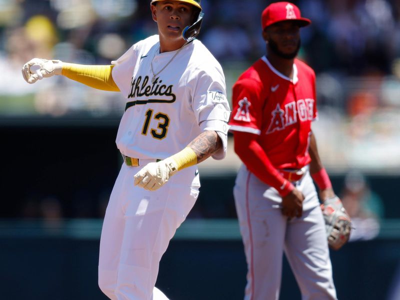 May 22, 2025; West Sacramento, California, USA; Athletics third baseman Gio Urshela (13) stands on second after hitting a double during the third inning against the Los Angeles Angels at Sutter Health Park. Mandatory Credit: Sergio Estrada-Imagn Images
