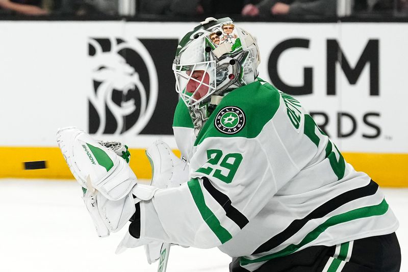 Jan 28, 2025; Las Vegas, Nevada, USA; Dallas Stars goaltender Jake Oettinger (29) makes a glove save against the Vegas Golden Knights during the second period at T-Mobile Arena. Mandatory Credit: Stephen R. Sylvanie-Imagn Images