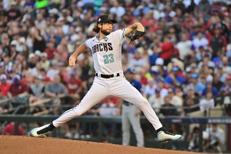 Nov 1, 2023; Phoenix, AZ, USA; Arizona Diamondbacks starting pitcher Zac Gallen (23) pitches in the second inning against the Texas Rangers in game five of the 2023 World Series at Chase Field. Mandatory Credit: Matt Kartozian-USA TODAY Sports