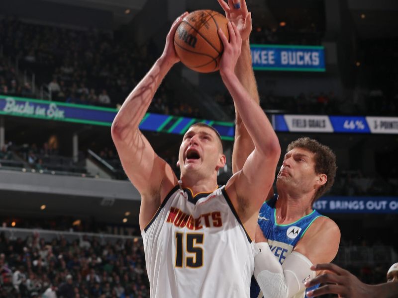 MILWAUKEE, WI - FEBRUARY 12: Nikola Jokic #15 of the Denver Nuggets drives to the basket during the game against the Milwaukee Bucks on February 12, 2024 at the Fiserv Forum Center in Milwaukee, Wisconsin. NOTE TO USER: User expressly acknowledges and agrees that, by downloading and or using this Photograph, user is consenting to the terms and conditions of the Getty Images License Agreement. Mandatory Copyright Notice: Copyright 2024 NBAE (Photo by Gary Dineen/NBAE via Getty Images).