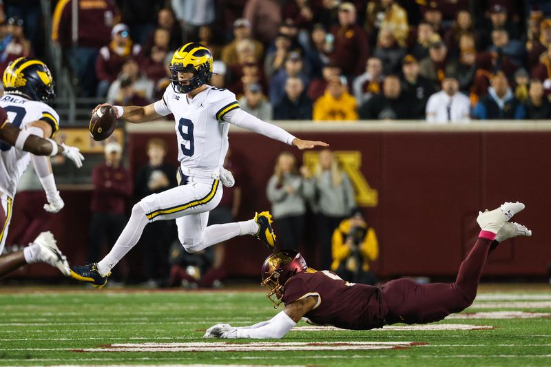 Oct 7, 2023; Minneapolis, Minnesota, USA; Michigan Wolverines quarterback J.J. McCarthy (9) runs the ball against the Minnesota Golden Gophers during the first quarter at Huntington Bank Stadium. Mandatory Credit: Matt Krohn-USA TODAY Sports